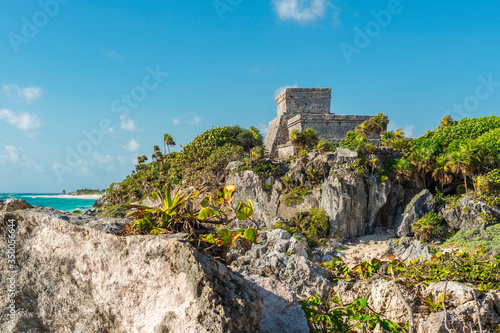 The Mayan Ruin of Tulum and its beach by the Caribbean Sea  Quintana Roo State  Yucatan Peninsula  Mexico. Foreground unsharp  sharp building.
