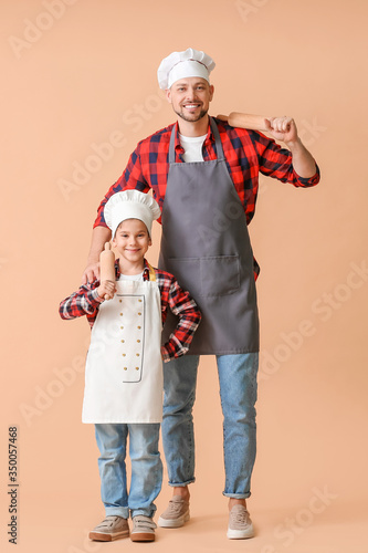 Male chef and his little so...