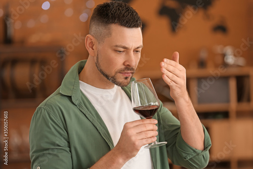Man tasting wine at the restaurant