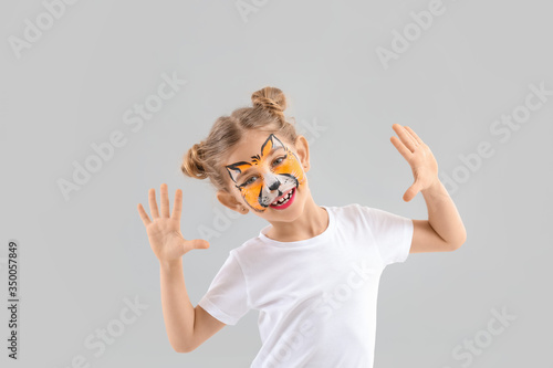 Funny little girl with face...