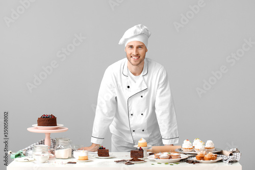 Male confectioner with tast...