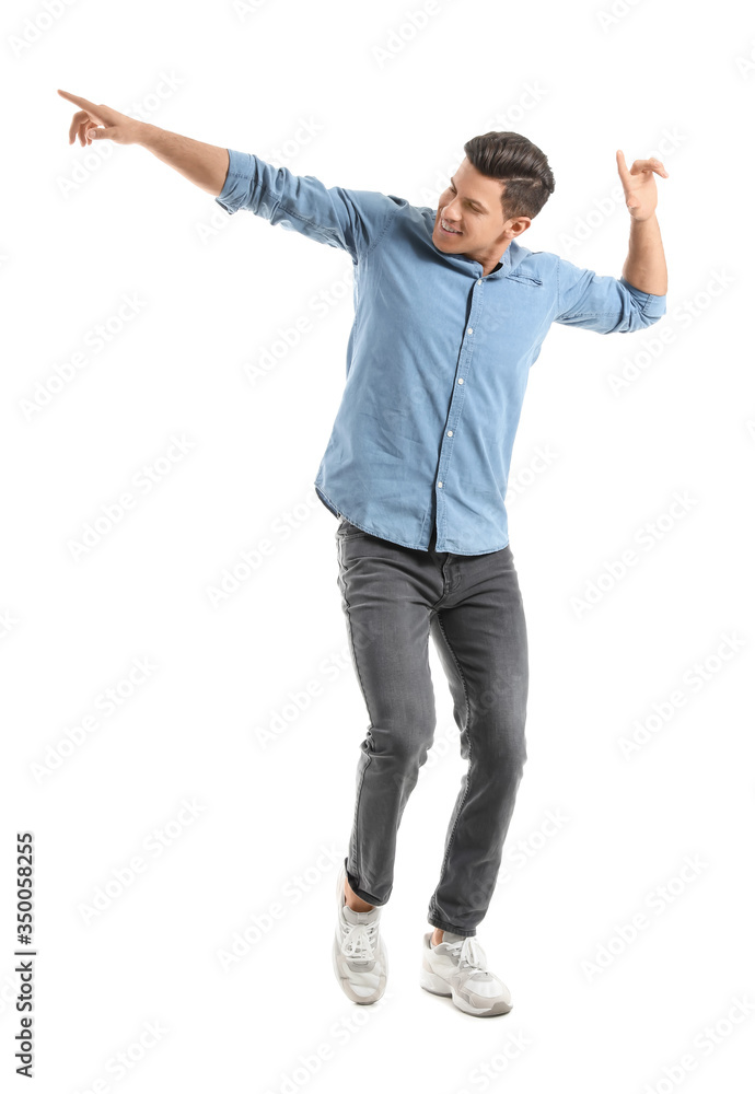 Handsome young man dancing against white background Handsome young man dancing against white background