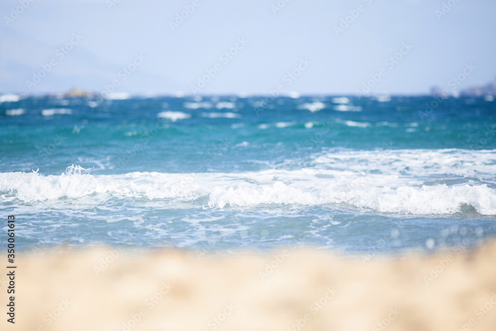 close up on white sand and sea waves travel background close up on white sand and sea waves travel background
