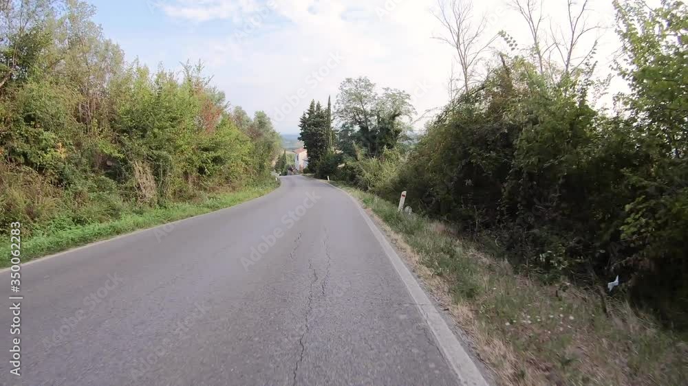 secondary paved road next to San Gimignano, province of Siena, Tuscany, Italy secondary paved road next to San Gimignano, province of Siena, Tuscany, Italy