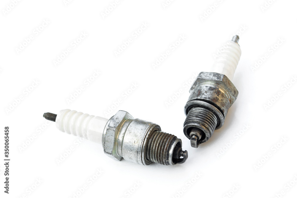 Spark plugs old isolated on a white background. Spark plugs old isolated on a white background.