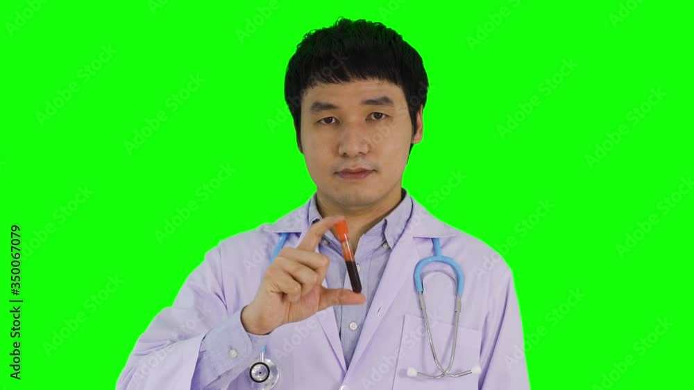 male doctor holding blood tube with green screen background
male doctor holding blood tube with green screen background