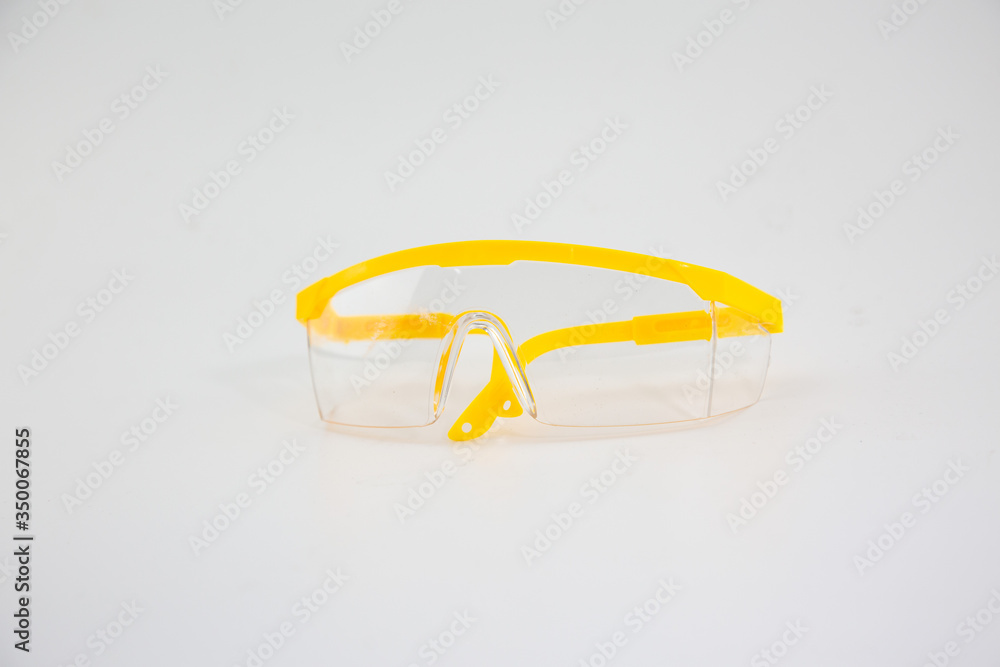 Yellow plastic medical eyes on a white background Yellow plastic medical eyes on a white background