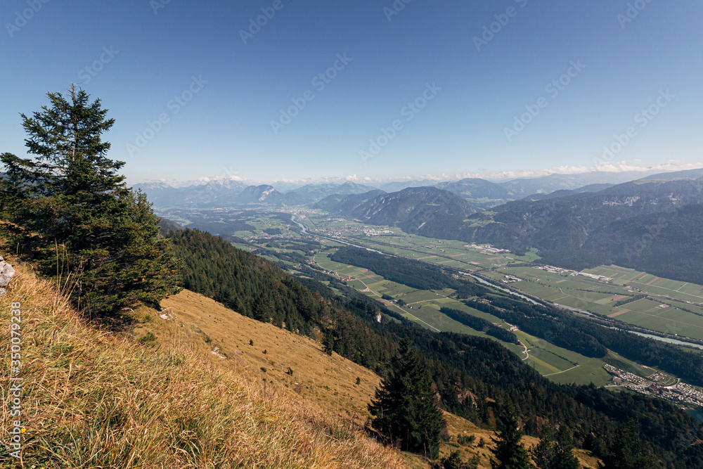 Fototapeta premium View over the Inntal valley from a hiking trail with the towns of Kundl and Worgl visible. Tyrol, Austria.