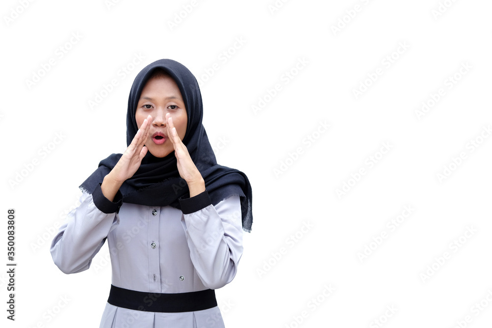 Young beautiful girl speaks in a hand loudspeaker on a white background. Young beautiful girl speaks in a hand loudspeaker on a white background.