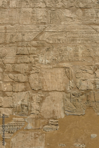 Egyptian ancient hieroglyphs on the stone wall