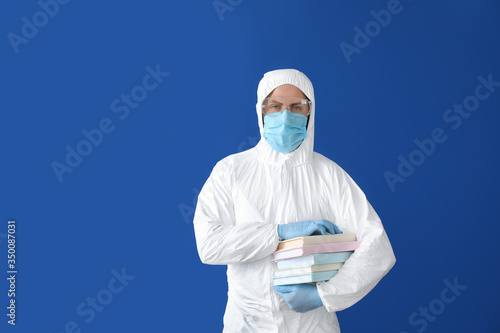 Man in biohazard suit and w...