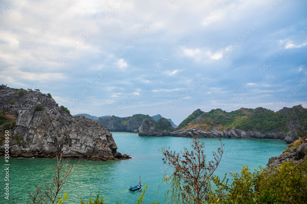 Halong Bay, Vietnam,  with limestone hills. Dramatic landscape of Ha Long bay, a UNESCO world heritage site and a popular tourist destination.