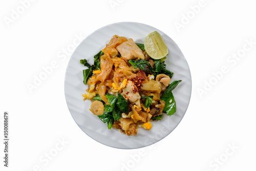Fried big noodle with pork and Chinese kale with ingredients, Thai cooking and restaurant food