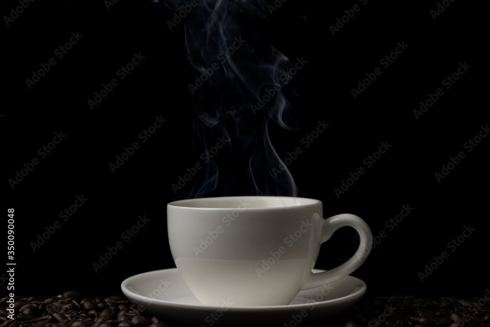 Hot black coffee with white smoke motion blur up on the air on black background Hot black coffee with white smoke motion blur up on the air on black background
