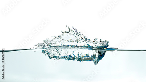Abstract water wave splash isolated on white background.