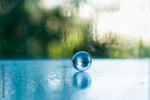glass ball with reflection in water