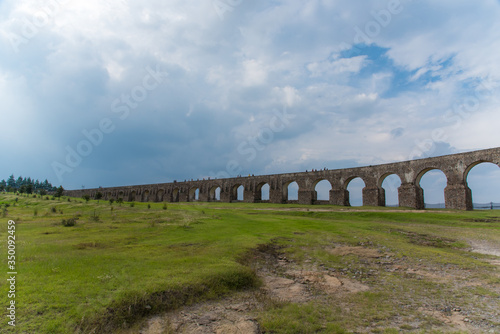 Aqueduct Los Arcos Tepotzotlán, Mexico October 07 2018 A wide arched passageway in the back of the complex leads to the extensive gardens area of more than 3 hectares, filled with gardens,