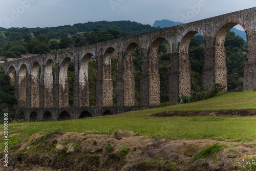 Aqueduct Los Arcos Tepotzotlán, Mexico October 07 2018 A wide arched passageway in the back of the complex leads to the extensive gardens area of more than 3 hectares, filled with gardens,