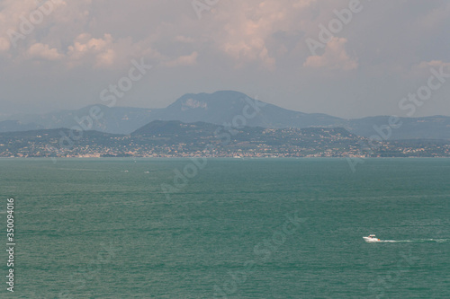 Lake Garda with mountains on background, Lombardy, Italy.