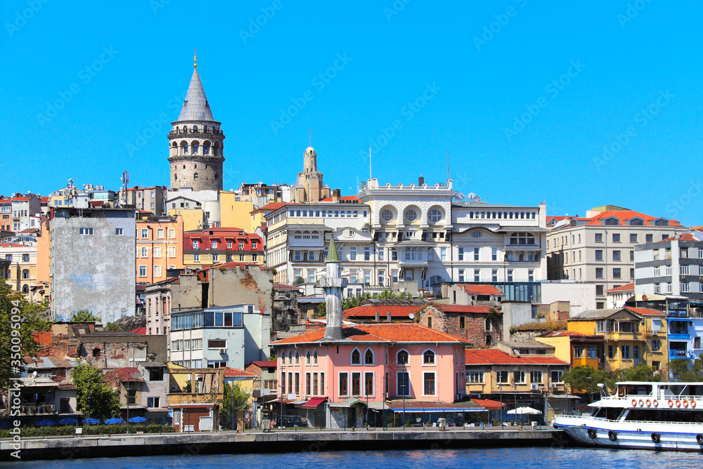 View from water on Galata Tower and Beyoglu district, Istanbul, Turkey