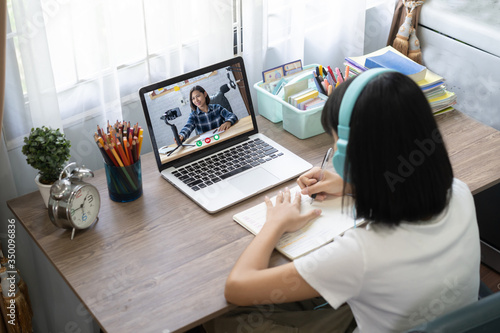 Girl studying homework online lesson at home, Social distance online education idea concept