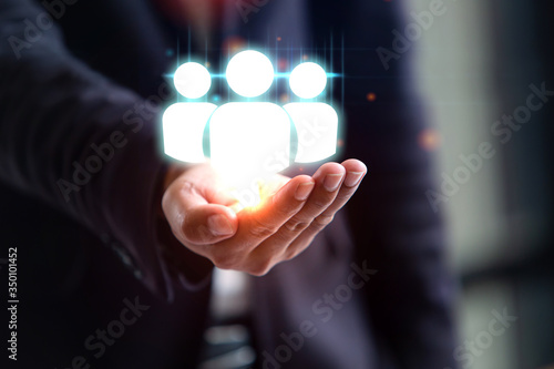 close-up concept supervisor business support hand holding group of people icon