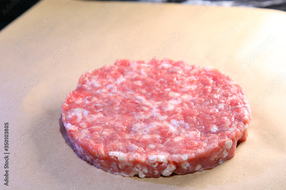 Raw cutlet for a juicy burger. Raw cutlet for a juicy burger.