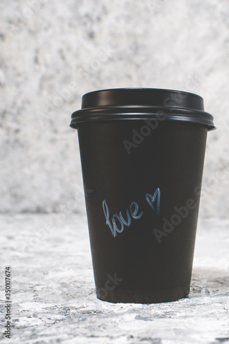 black coffee paper cup on grunge background