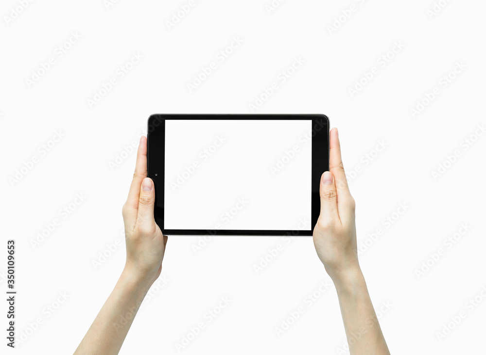 Close-up of hand holding black tablet isolated on white background. Close-up of hand holding black tablet isolated on white background.
