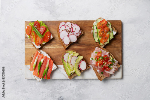 Bruschetta with toppings on the light background