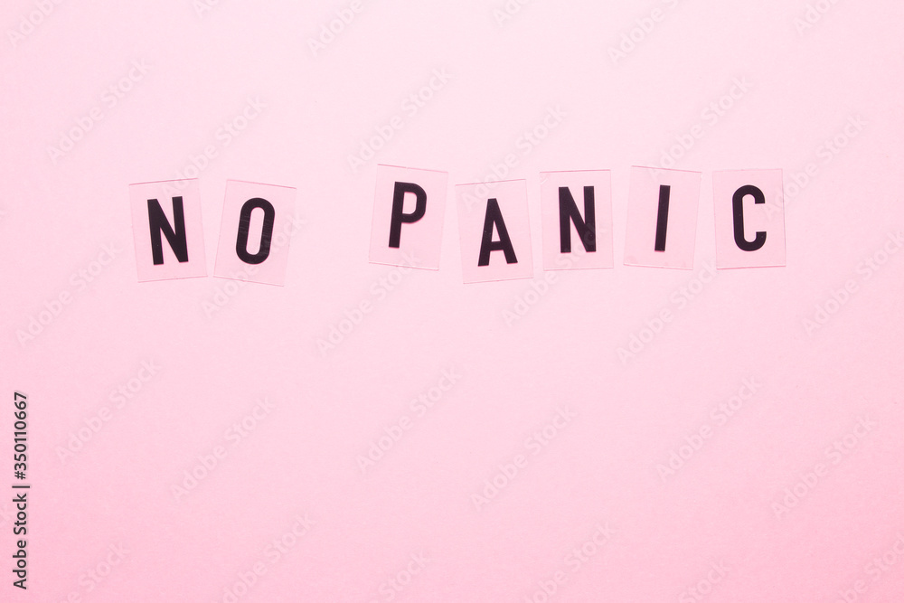 The inscription no panic on a pink background close-up. The inscription no panic on a pink background close-up.