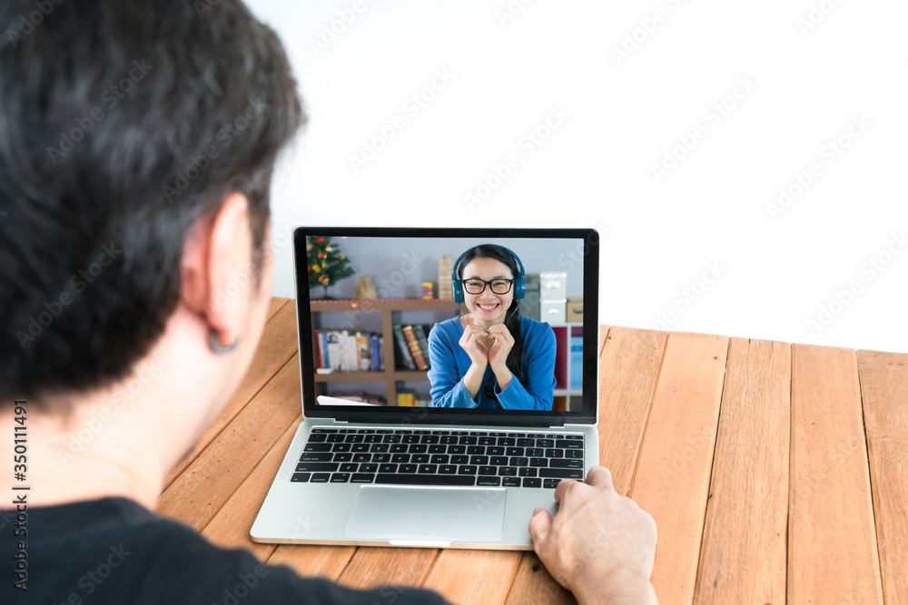 Couple using laptop for video chatting . Remote communication concept Couple using laptop for video chatting . Remote communication concept