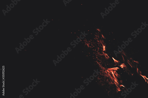 motion fire flame sparkles in dark environment space background