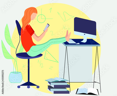 Online education. A teenager is sitting at a computer
