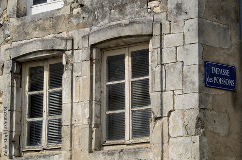 Old building and street sign in La Rochelle