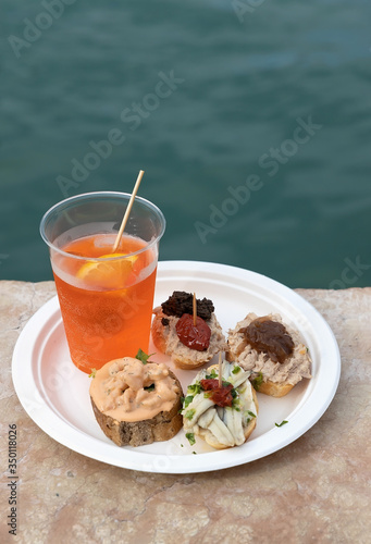 Cicchetti and Aperol Spritz traditional venetian food and drink.
