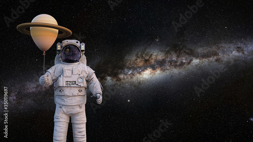 Fototapeta Naklejka Na Ścianę i Meble -  astronaut with planet Saturn balloon background with empty space