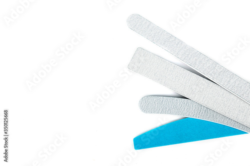 Nail files isolated on white background. The concept of manicure, body care. Creative background, copy space.