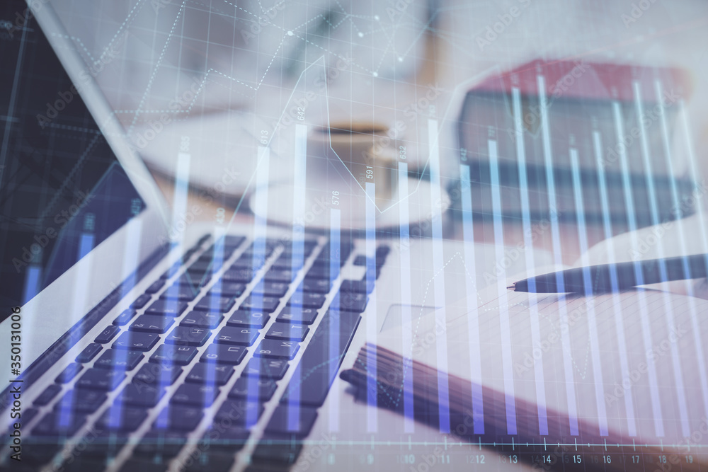 Double exposure of financial chart drawing and desktop with coffee and items on table background. Concept of forex market trading Double exposure of financial chart drawing and desktop with coffee and items on table background. Concept of forex market trading