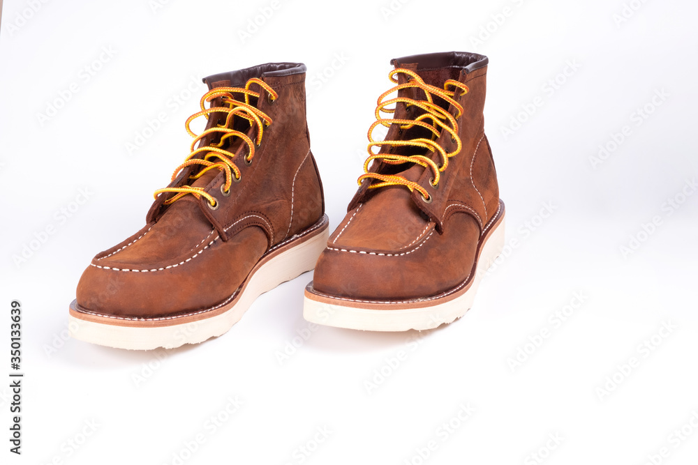 Brown boot on white background.