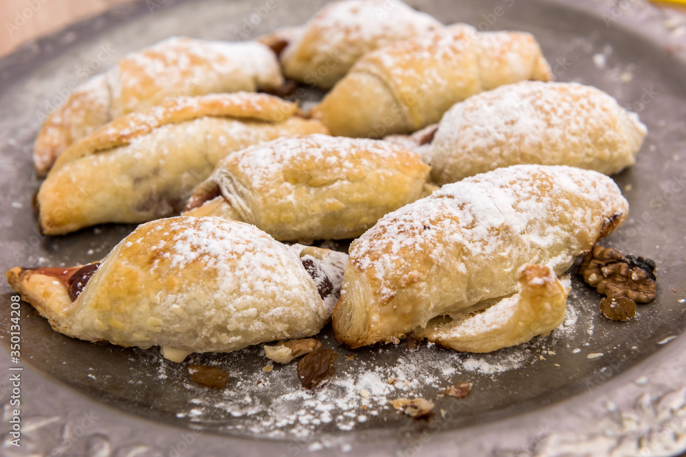 bakery fresh bun dusted powdered sugar. closeup bakery fresh bun dusted powdered sugar. closeup