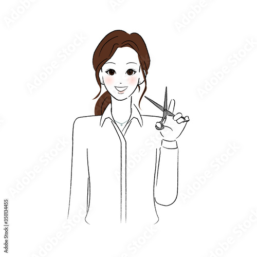 ハサミを持った女性美容師