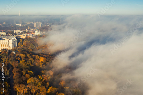 Aerial drone view. Houses in the city center of Kiev on a foggy morning.