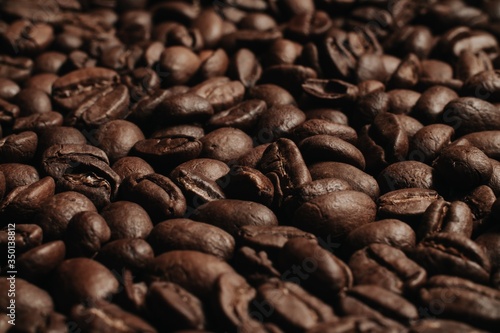 roasted coffee beans, can be used as background. Coffee production concept for coffee shop. Grains after roasting