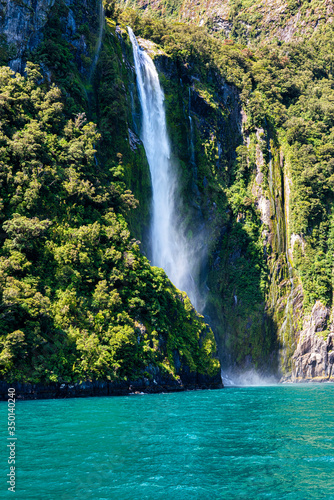 Vászonkép Waterfall in Milford Sound's fiord land in the south island of New Zealand
