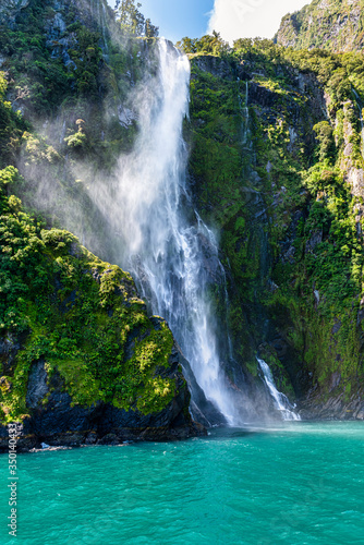 Waterfall in Milford Sound's fiord land in the south island of New Zealand.
