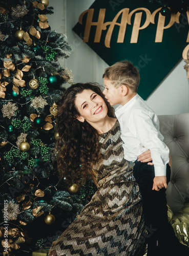 smart mom and son under the tree