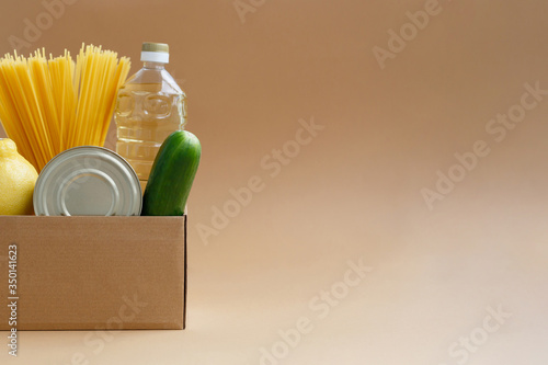 Box with a supply of food. Donation of products for the needy photo