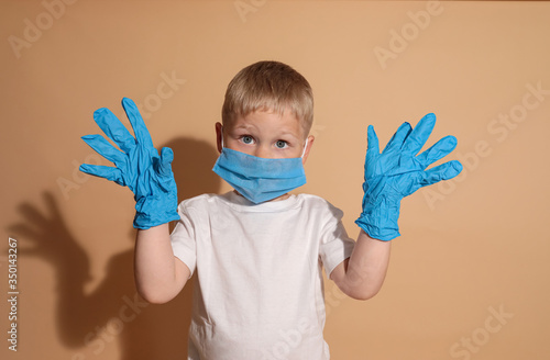 boy in a blue medical mask