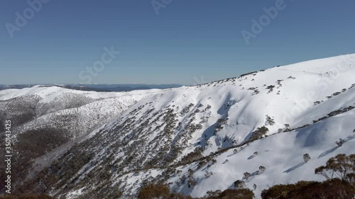 Beautiful sunny day in the snowy mountains of Hotham, Australia, slow motion photo